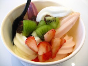 Yogurt Art Frozen Yogurt Four flavors from the upper left working clockwise: pomegranate, original, Georgia peach, and lychee. Three toppings are brown sugar mochi, kiwi and strawberry.